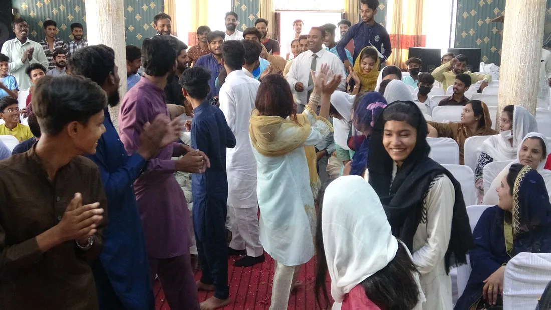 Young people gathered in a hall