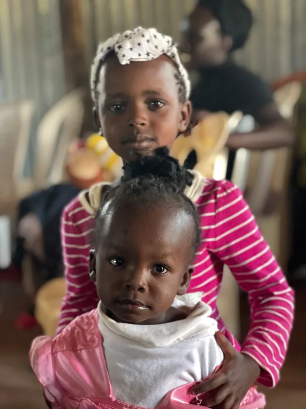 Two children seated together