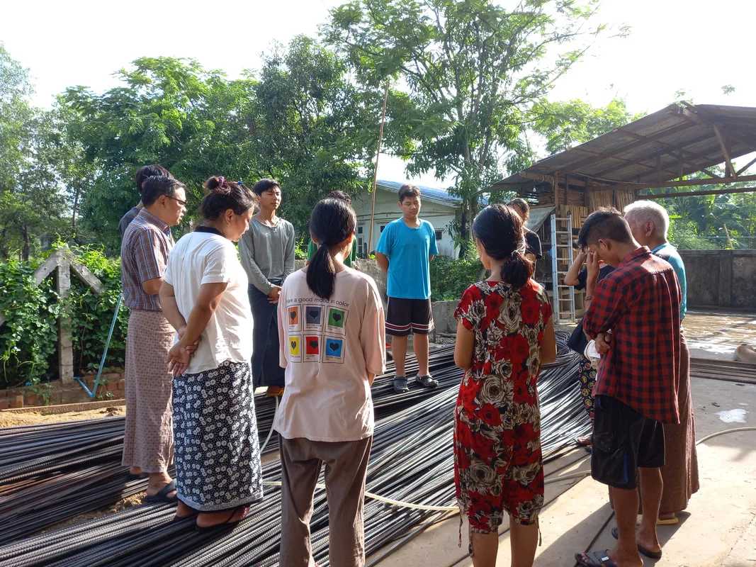 Young people gathered at a construction site