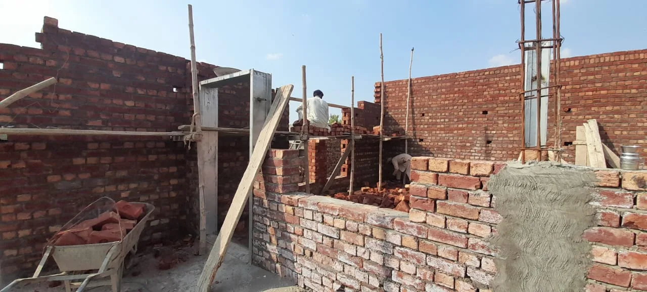 Unfinished brick walls with wooden supports