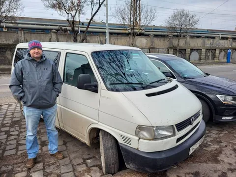 Man standing beside a white van