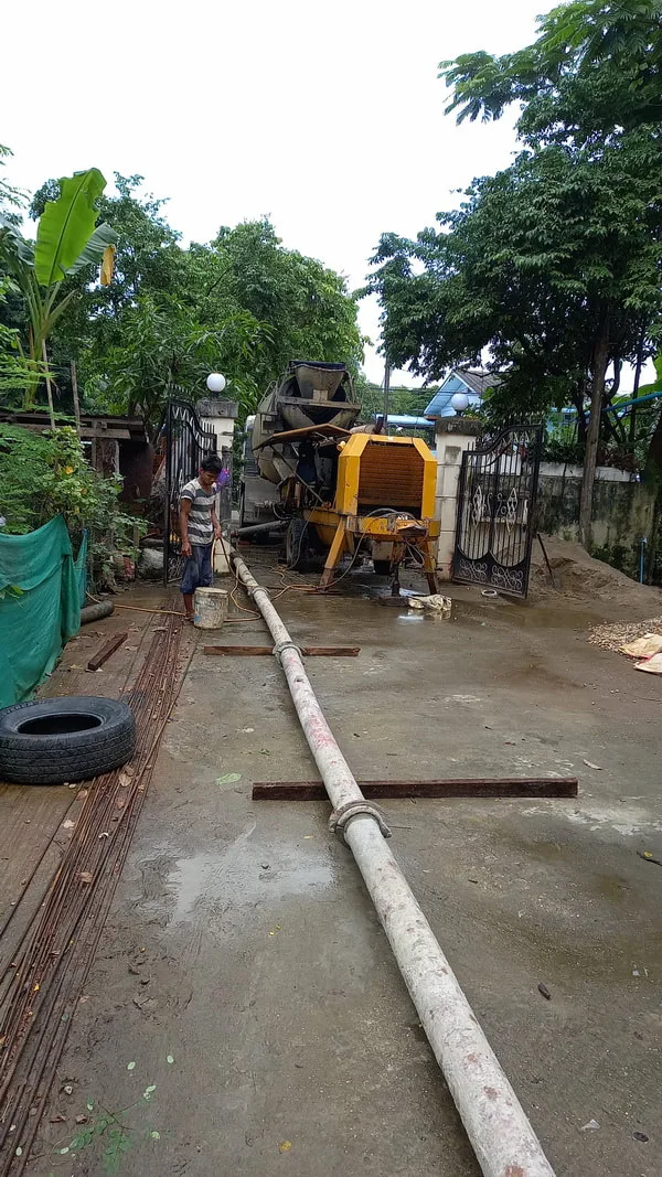 Concrete pump and pipe at a building site