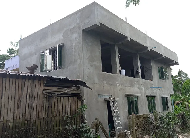Exterior walls and window openings of a two-story building