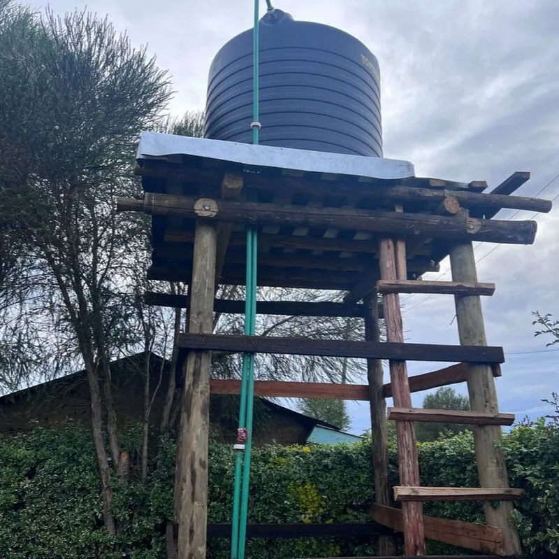 Elevated water tank on a wooden platform