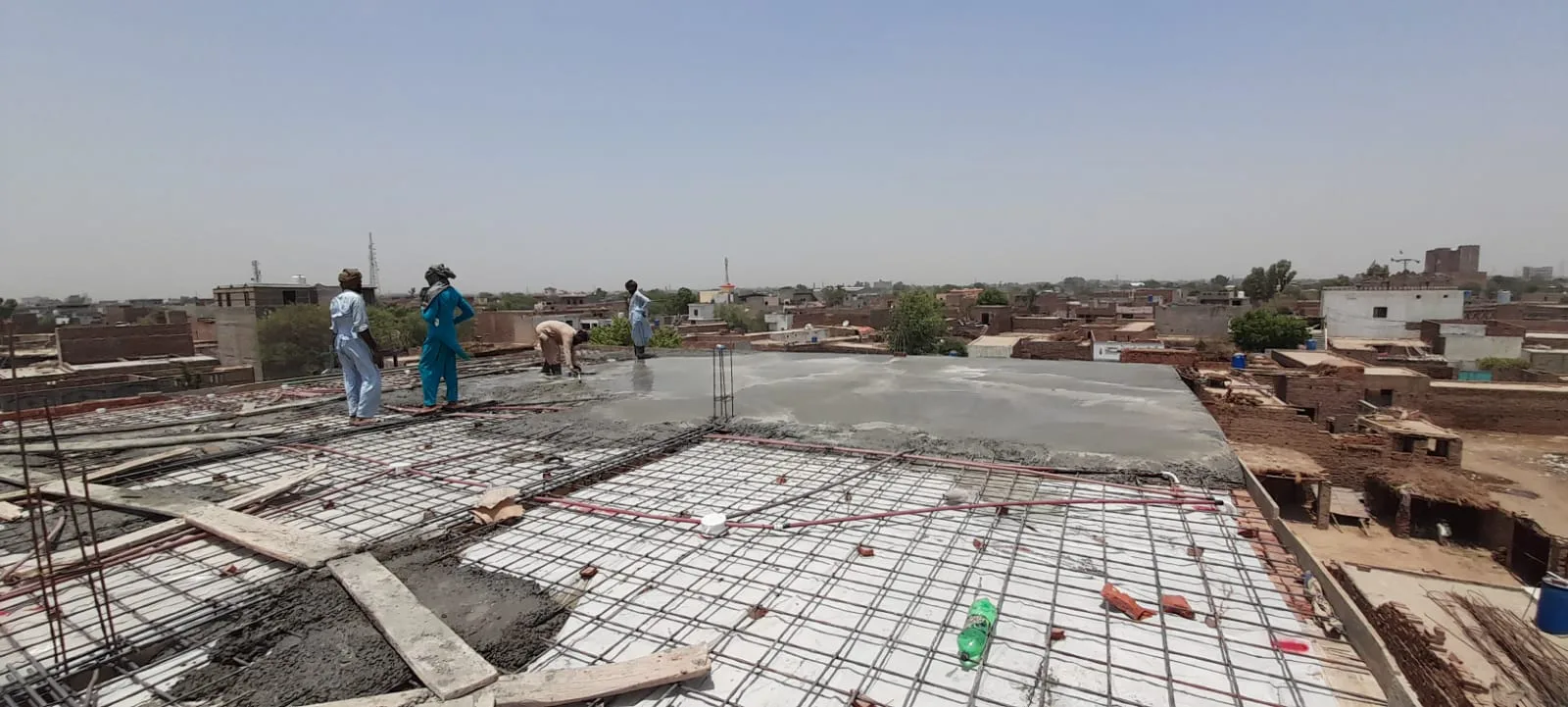 Roof reinforcement beside freshly poured concrete