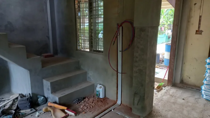 Electrical wiring beside a staircase