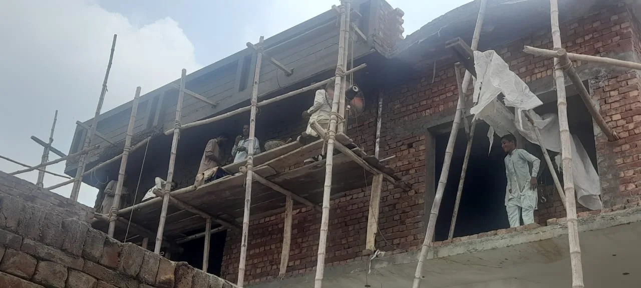 Exterior brick wall and temporary scaffolding