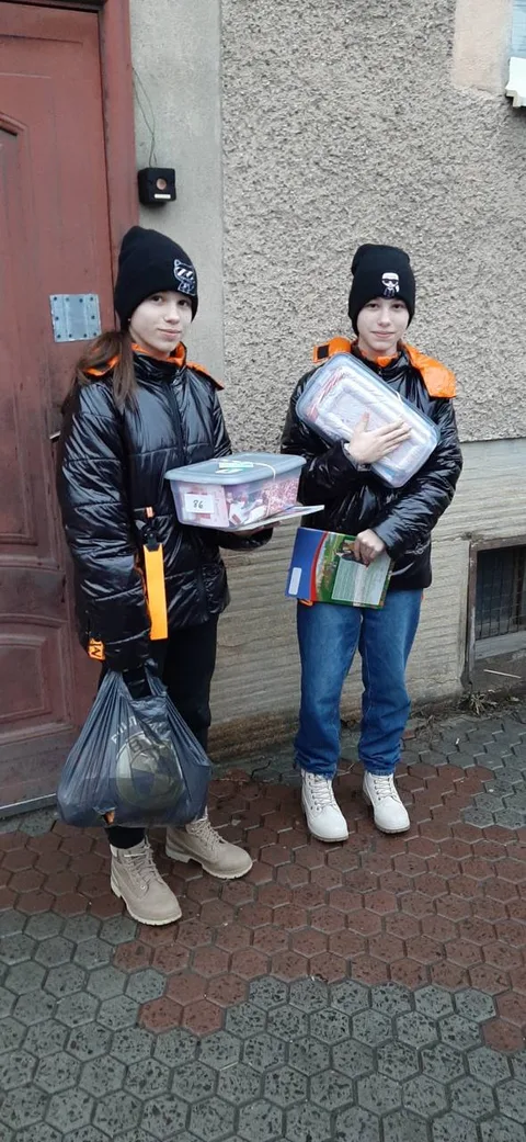Children carrying gifts outdoors