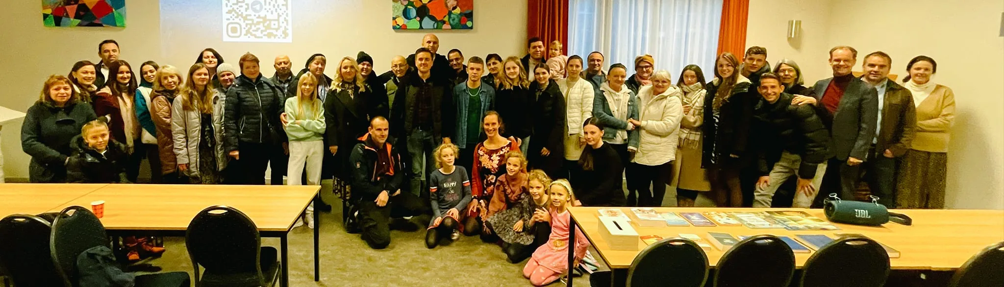 Large group gathered inside a hall