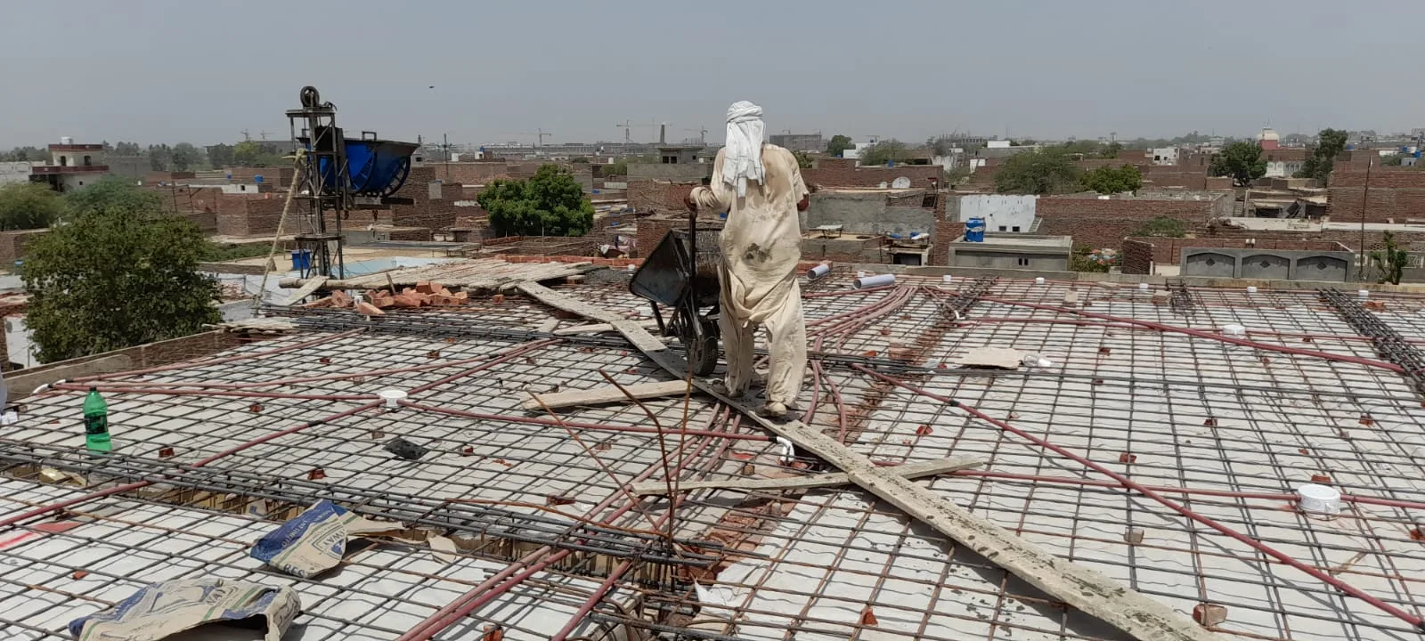 Steel reinforcement across a roof under construction