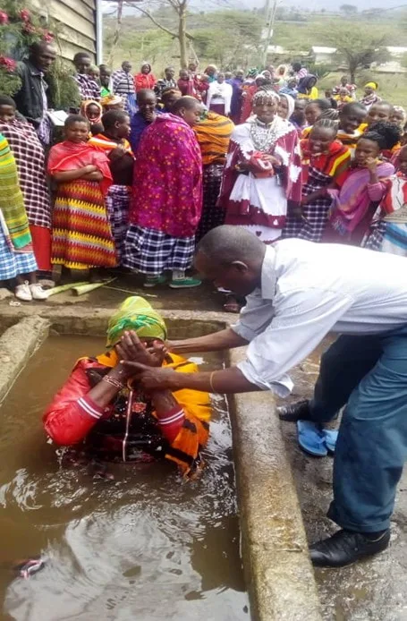 Woman at an outdoor baptismal pool