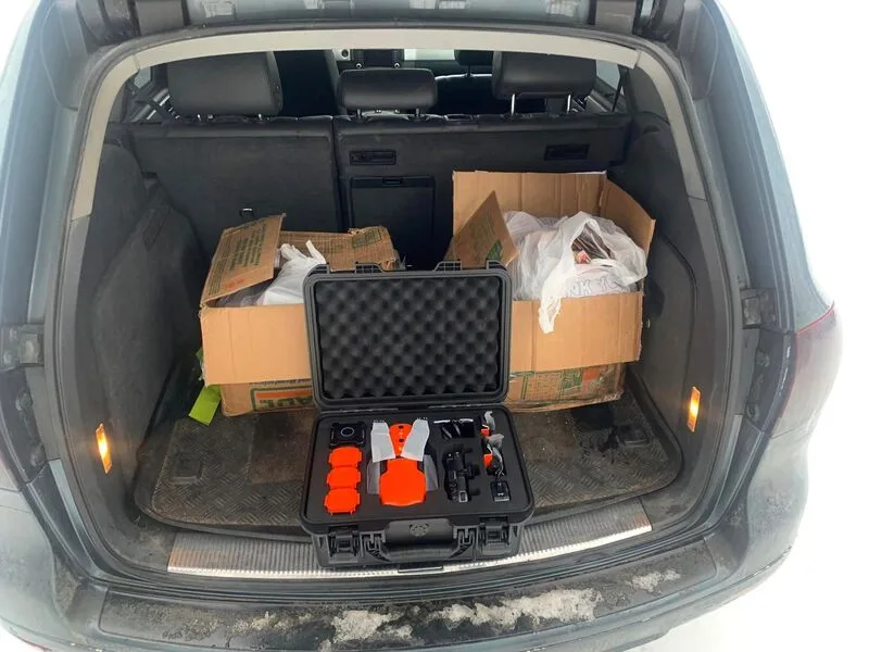 Supplies and a medical equipment case in the back of a vehicle