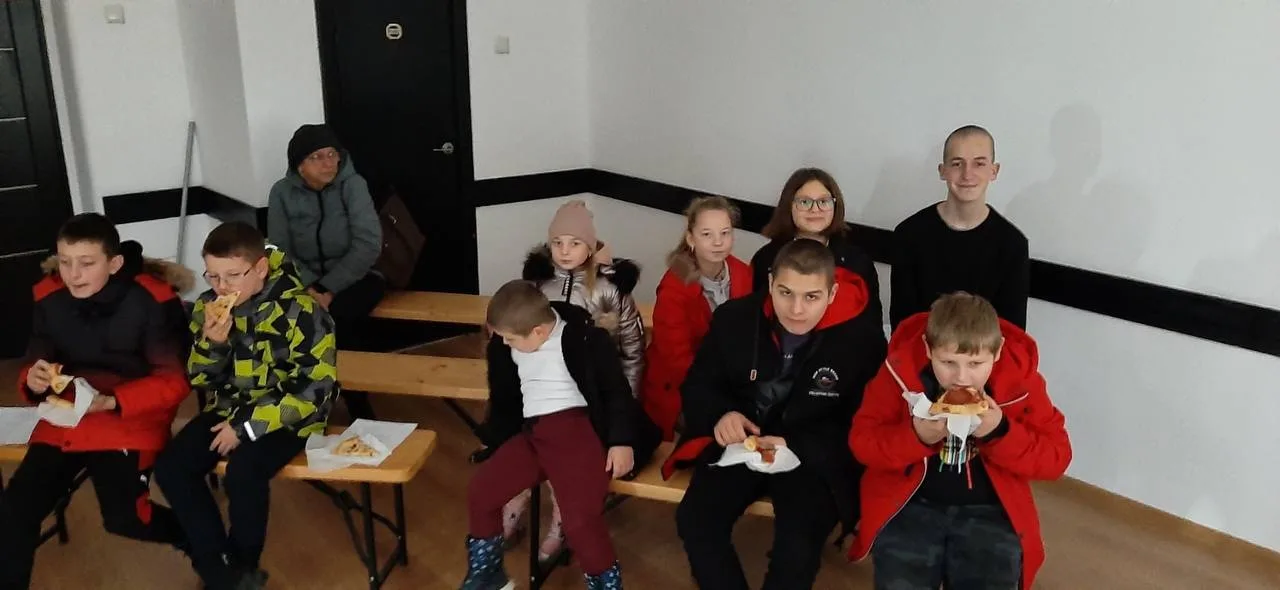 Children gathered with Christmas gifts