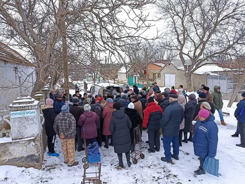 Outdoor gathering in a snow-covered courtyard