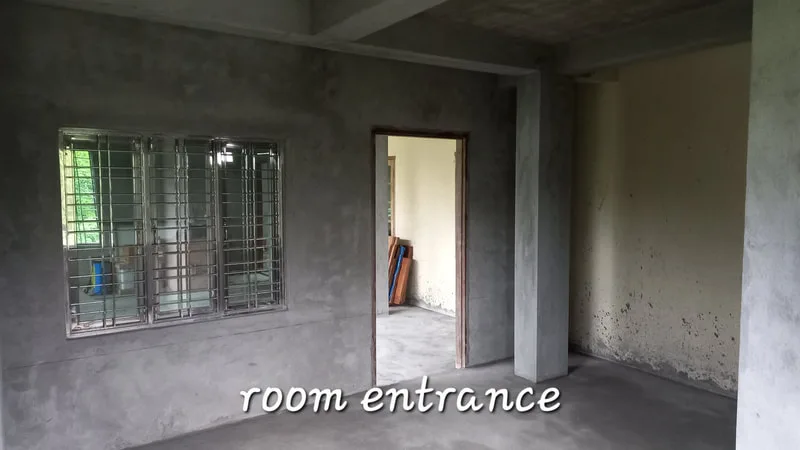 Room entrance beside a barred window