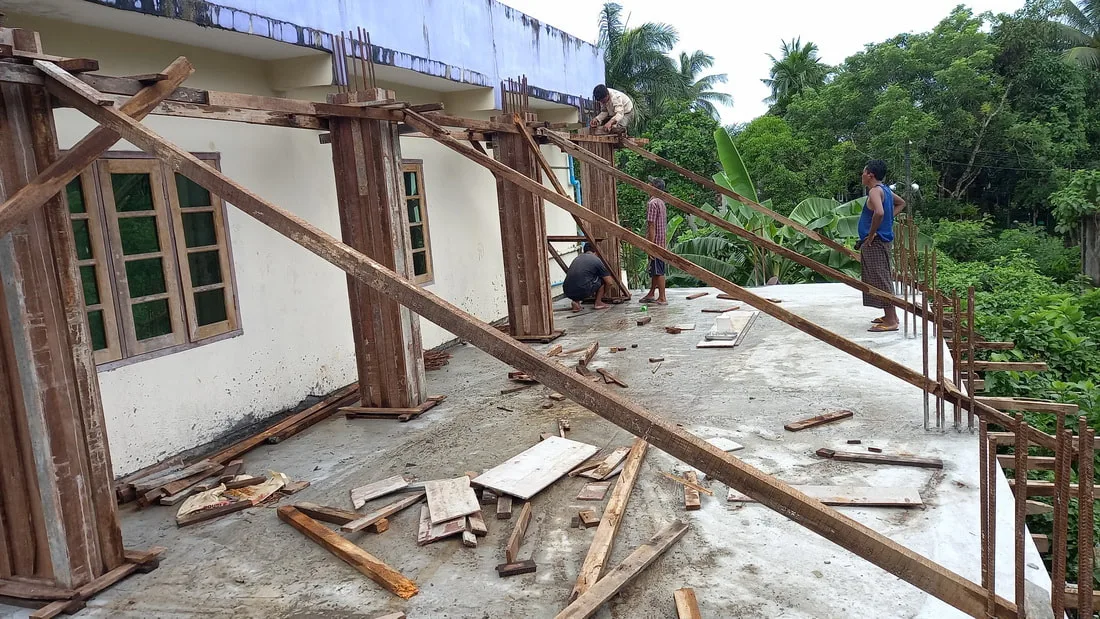 Workers constructing an upper floor