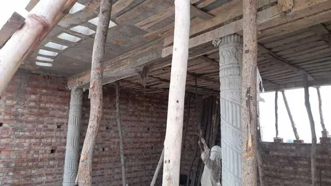 Temporary timber supports beneath a concrete roof