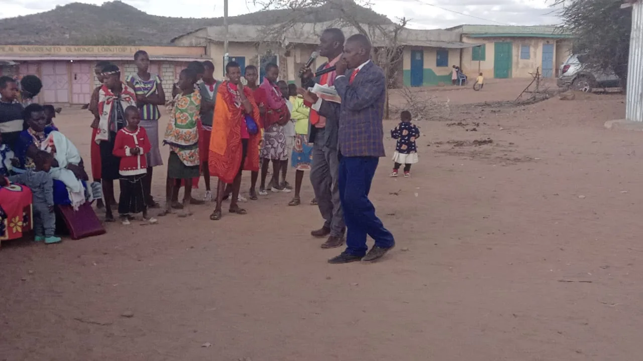 Man addressing an outdoor group