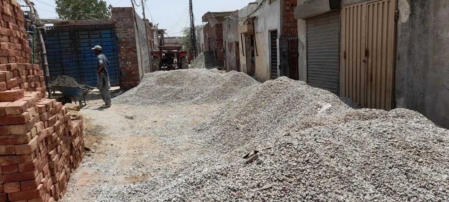 Gravel piled in a narrow street
