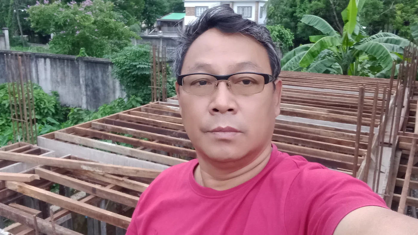 Man beside timber floor formwork