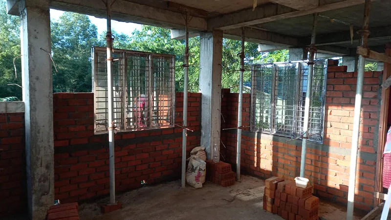 Brick walls and window openings inside a building