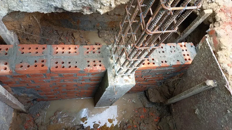 Brick footing around a reinforced concrete column