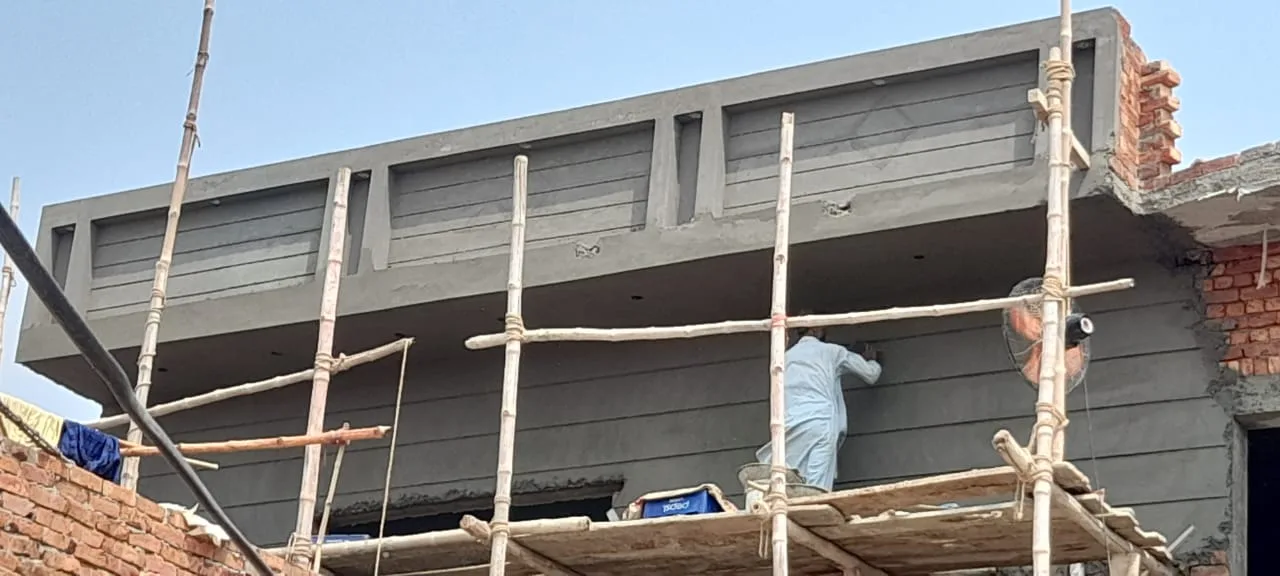 Fresh plaster along an upper floor facade