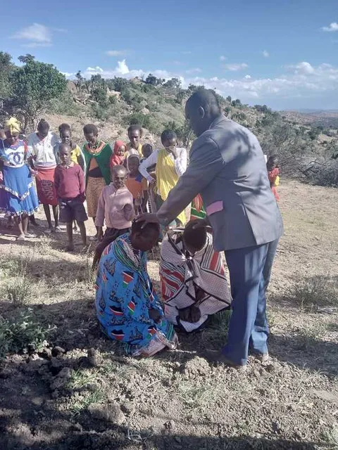 People gathered on a grassy hillside