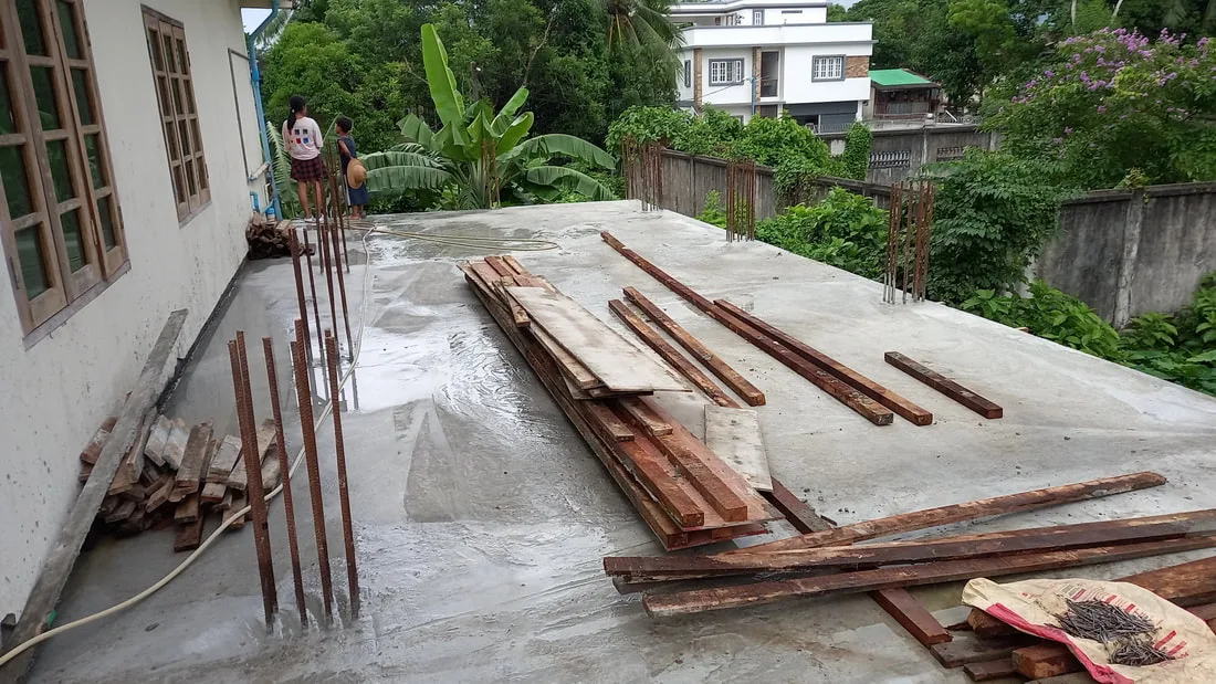 Finished concrete floor with stacked timber