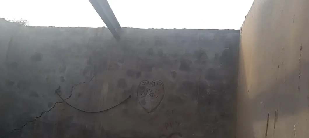 A roofless room with unfinished walls