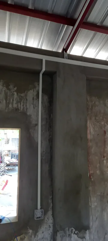 Interior wall beneath a metal roof
