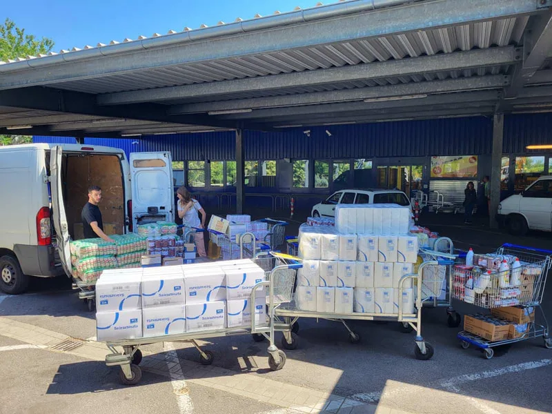 Food supplies being unloaded beside a warehouse