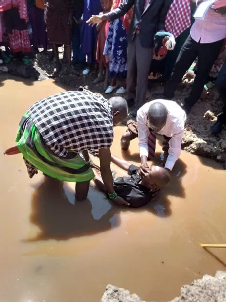 Man being baptized in an outdoor pool