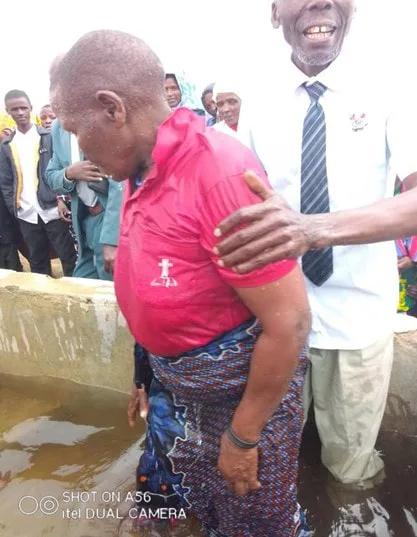 Two men at an outdoor baptism