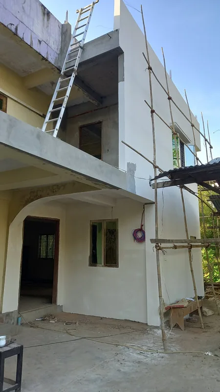 Painted exterior wall and balcony of a two-story building
