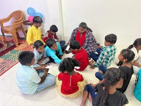 Children looking at books while seated in a circle