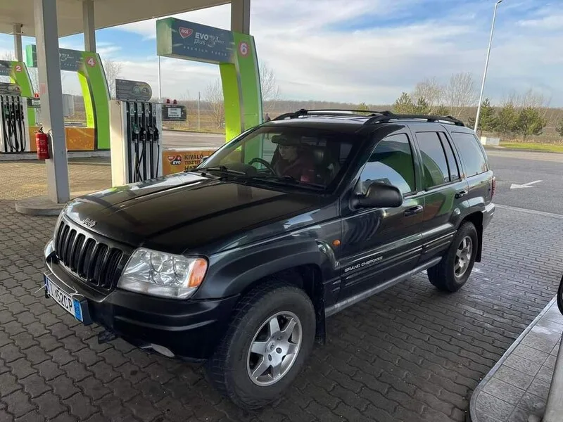 Dark-colored SUV at a fuel station