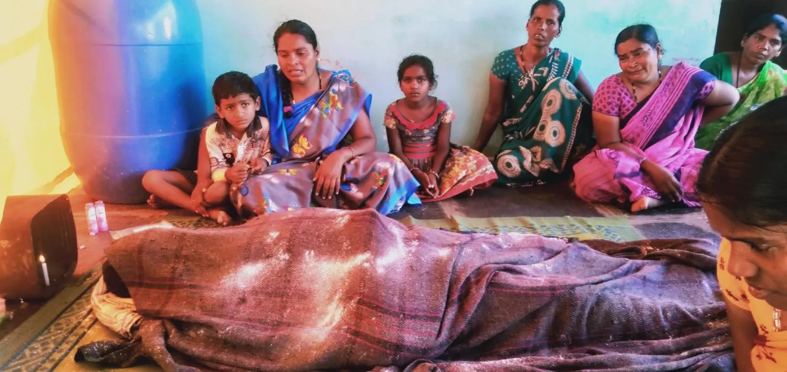 Family gathered around a bed
