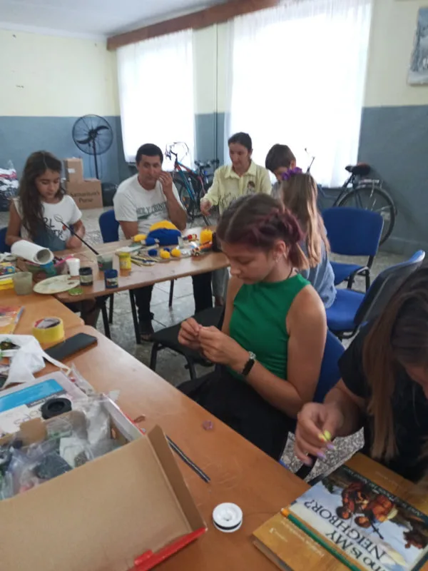 People making crafts at a table