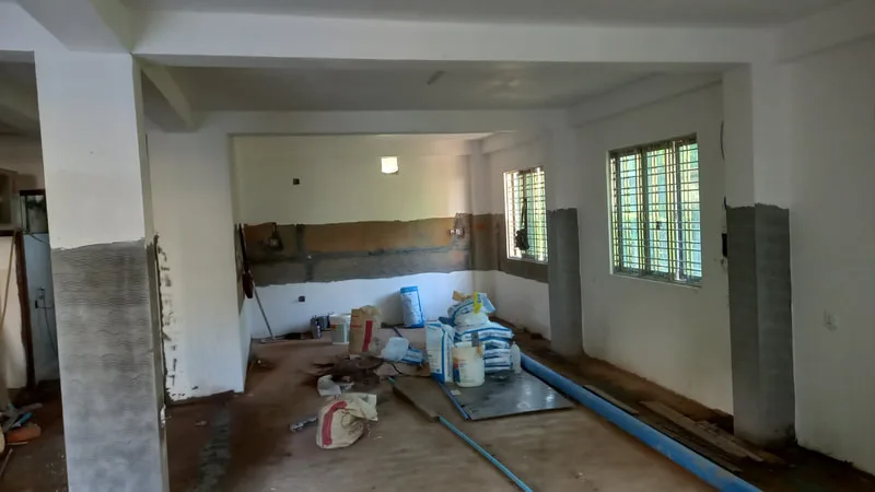 Newly painted kitchen interior with tools and supplies