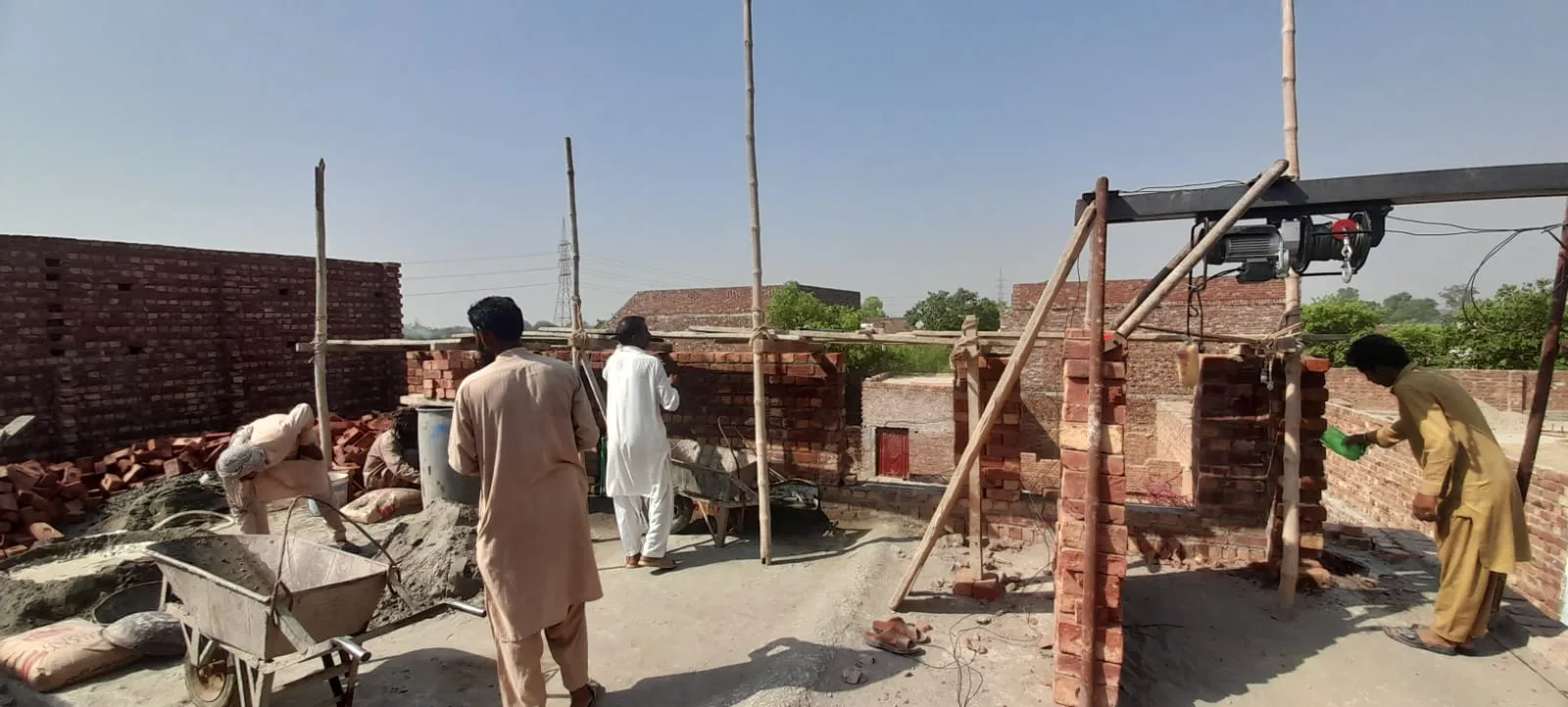 Workers carrying out masonry work