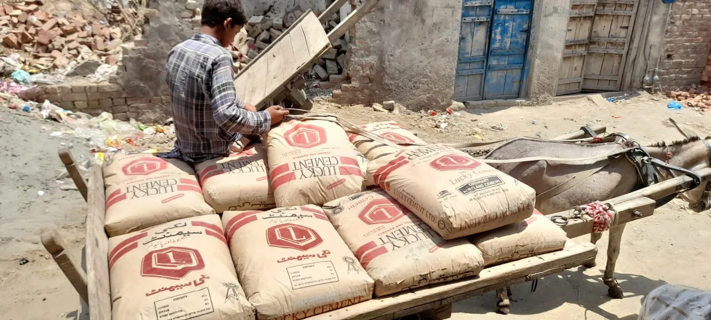 Bags of cement on a cart at a construction site