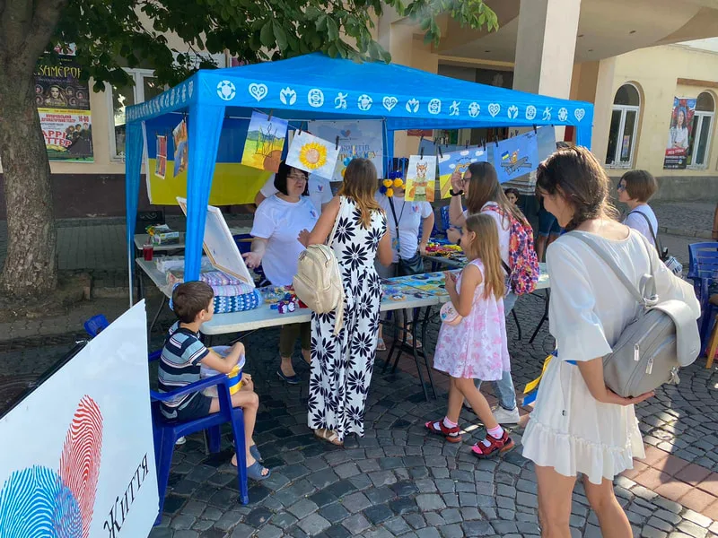 People visiting an outdoor information stall