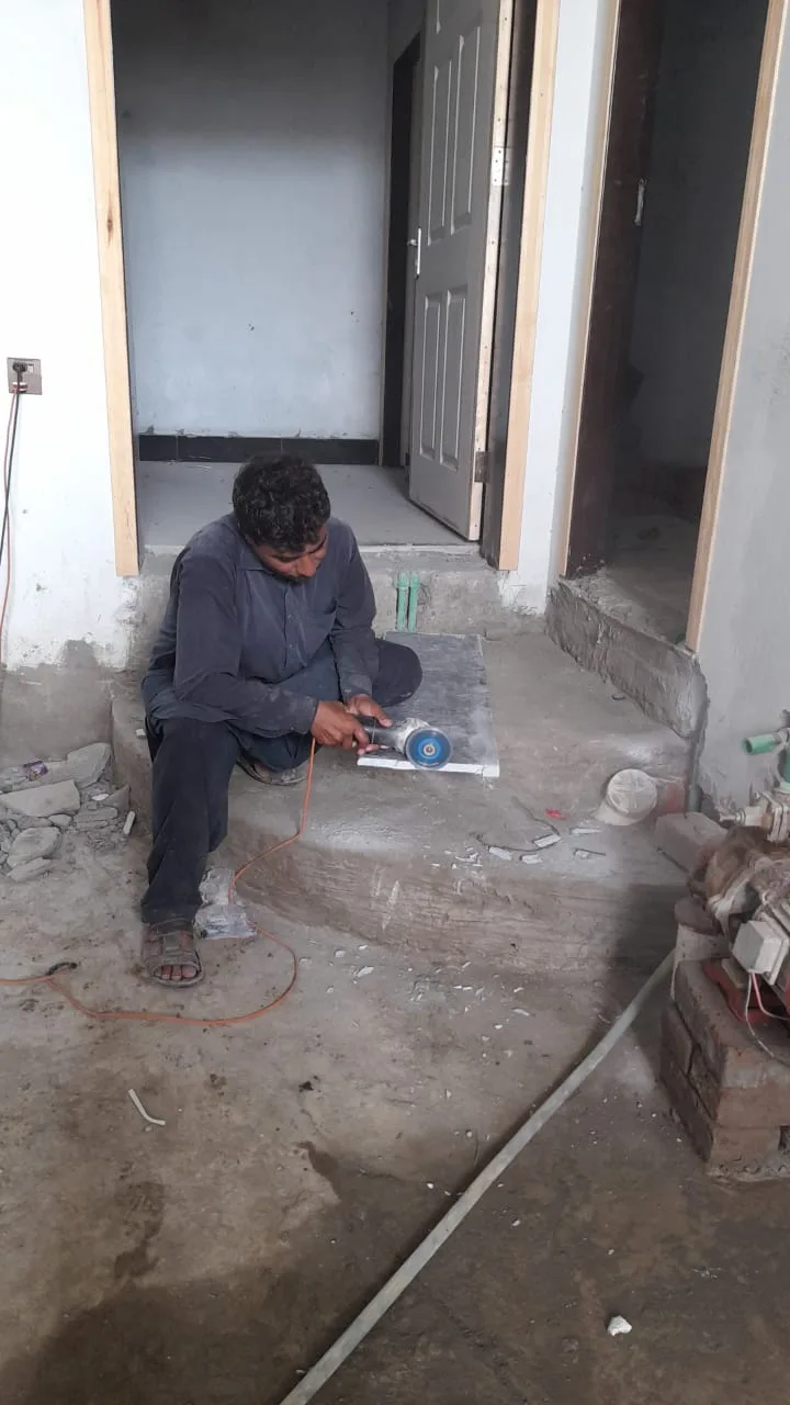 Worker fitting stone on a step