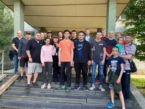 Group standing outside a church building
