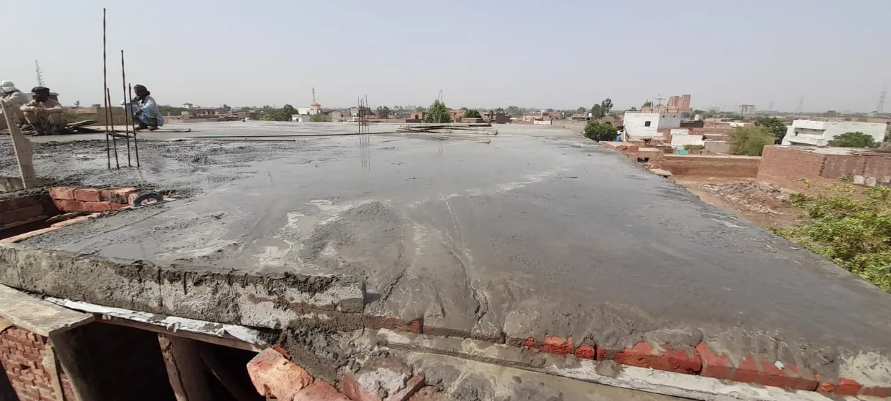 Fresh concrete across a roof slab