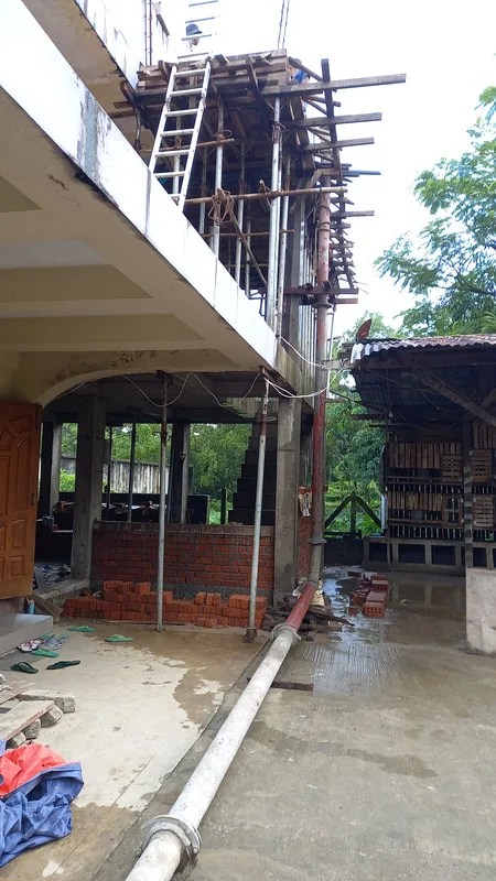 Concrete building with upper floor scaffolding