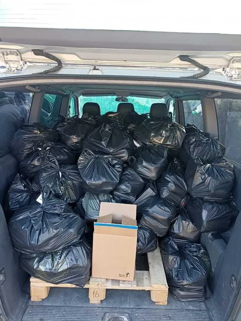Vehicle loaded with bags of relief supplies