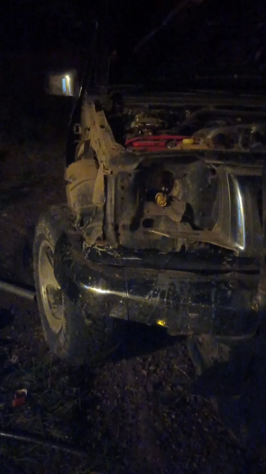 Damaged vehicle at night