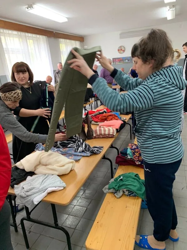 People sorting donated clothing